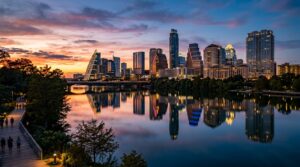 A vibrant sunset over the Austin Texas skyline and Lady Bird Lake.